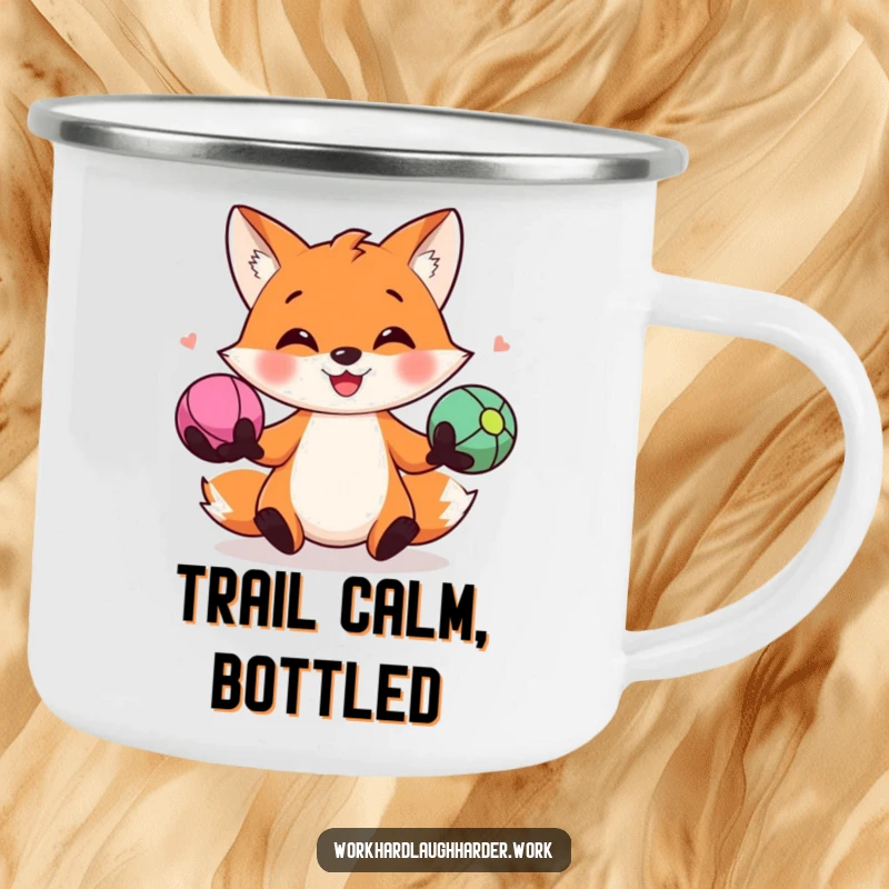 Funny camping mug showing a happy fox juggling three colorful stress balls, perfect for enjoying drinks in the great outdoors with a smile.