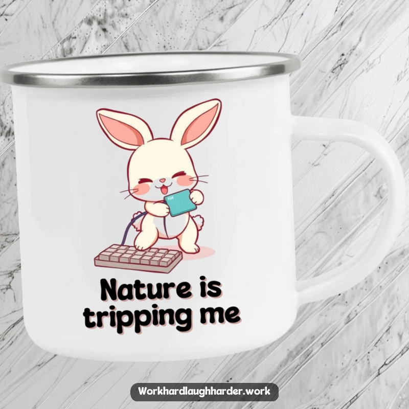 Funny camping mug featuring a bunny comically tripping over a keyboard cable, perfect for enjoying beverages during outdoor tech adventures.